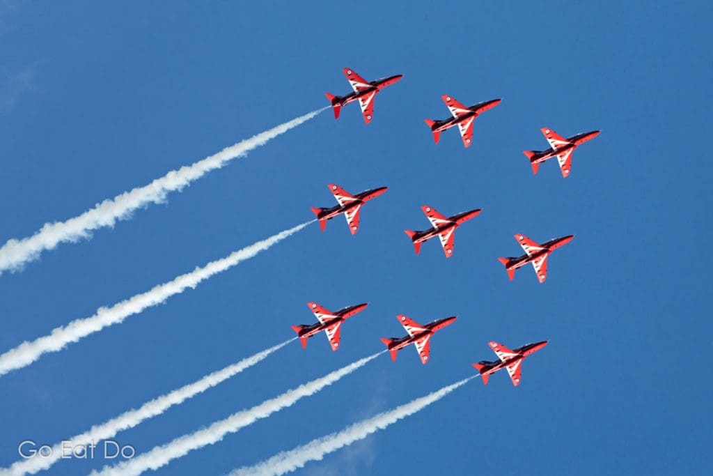The Red Arrows flying in formation during an aerobatics display over the North Sea.