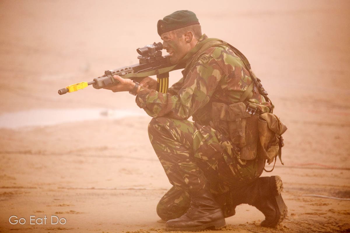 Royal Marine Commando takes a firing position on Seaburn Beach during the air show in Sunderland.