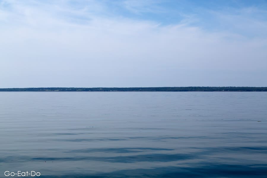 Calm water in the Passamaquoddy Bay. The stretch of water is an inlet to the Bay of Fundy, and between Canada and the USA.