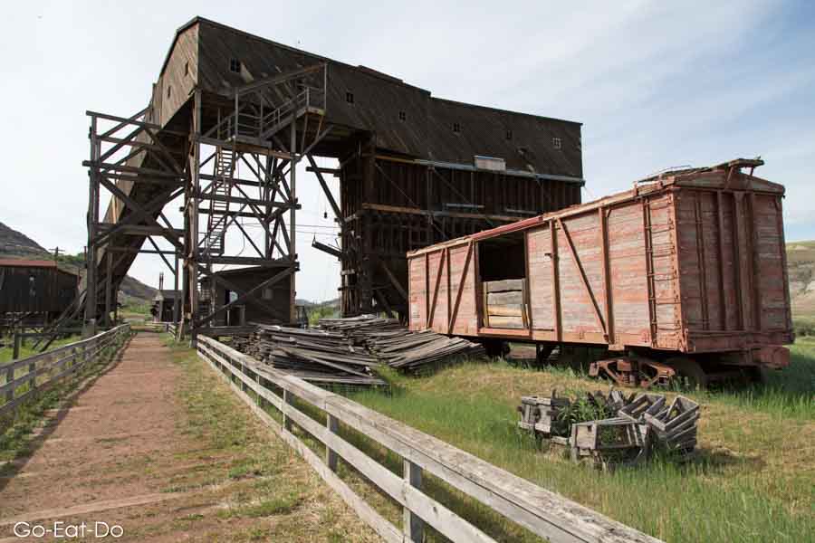 Rail carriage outside of the Atlas Coal Mine, a National Historic Site, in the Badlands of Alberta, Canada