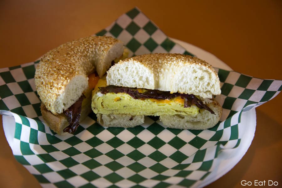 A breakfast bagel served at Slocum and Ferris. It is packed with egg and dulse.