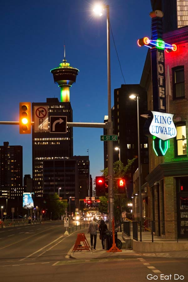 Calgary Tower stands in the downtown district, beyond the Hotel King Edward (the King Eddy) on 4th Street South East.