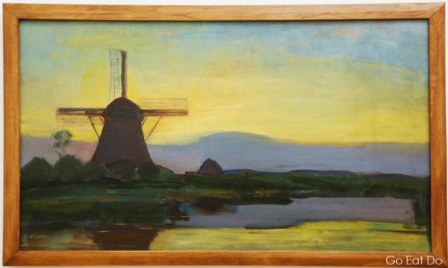 A windmill and landscape painted by Mondrian,