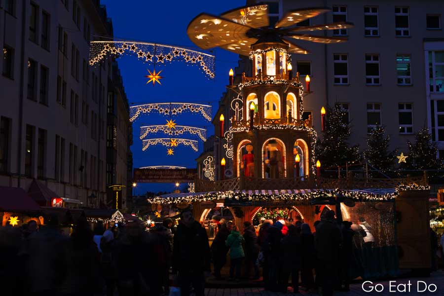 Busy streets by market stalls in Dresden's Old Town during Advent, when the city hosts the Striezelmarkt, Germany's oldest Christmas market