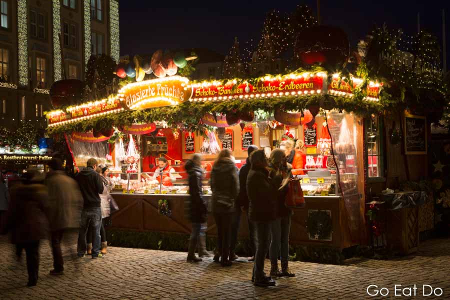 People enjoying an evening at the Striezelmarkt, in Dresden, Germany's oldest Christmas market