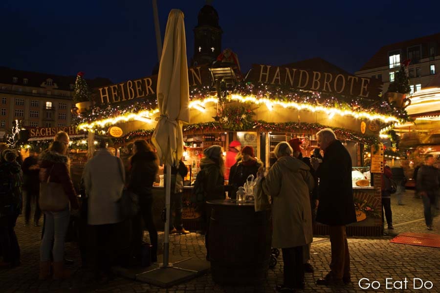 People enjoying an evening at the Striezelmarkt, in Dresden, Germany's oldest Christmas market