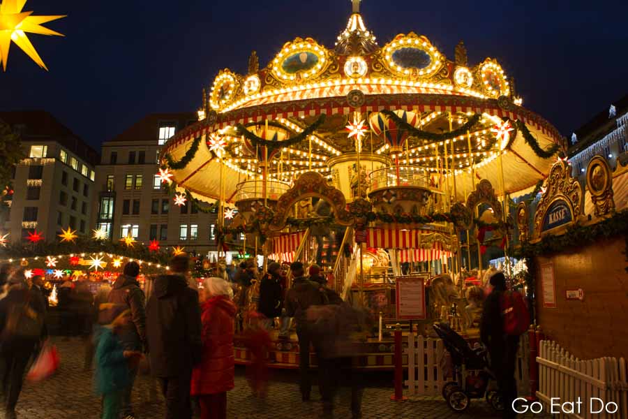 Carousel funfair at night at the Striezelmarkt, in Dresden, Germany's oldest Christmas market