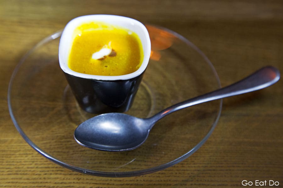 Amuse-bouche of spiced pumpkin soup served at the at Brasserie Midi restaurant in Groningen, the Netherlands