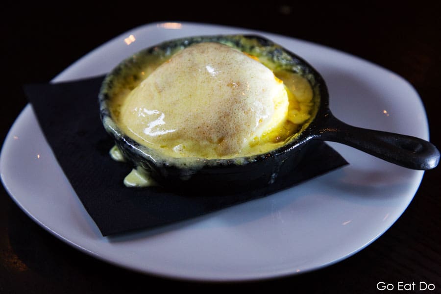 Cheese souffle served as a starter in an individual pan at The Rib Room restaurant at Ramside Hall in Durham, England