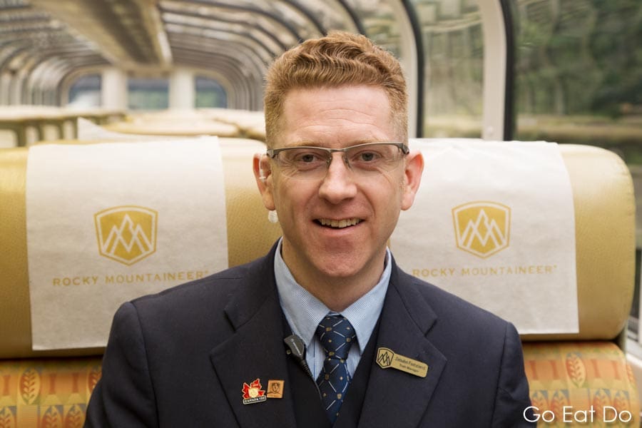 Train manager Zebulon Fastabend on the Rocky Mountaineer train in British Columbia, Canada.