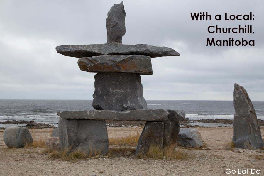 An Inukshuk on the shore of the Hudson Bay in Churchill, Manitoba, Canada. Inukshuk are standing stones erected by First Nations people.