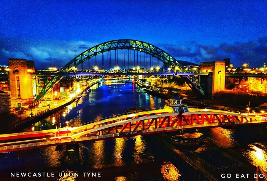 Swing Bridge and Tyne Bridge over the River Tyne in the blue hour of night night linking Newcastle and Gateshead in northeast England