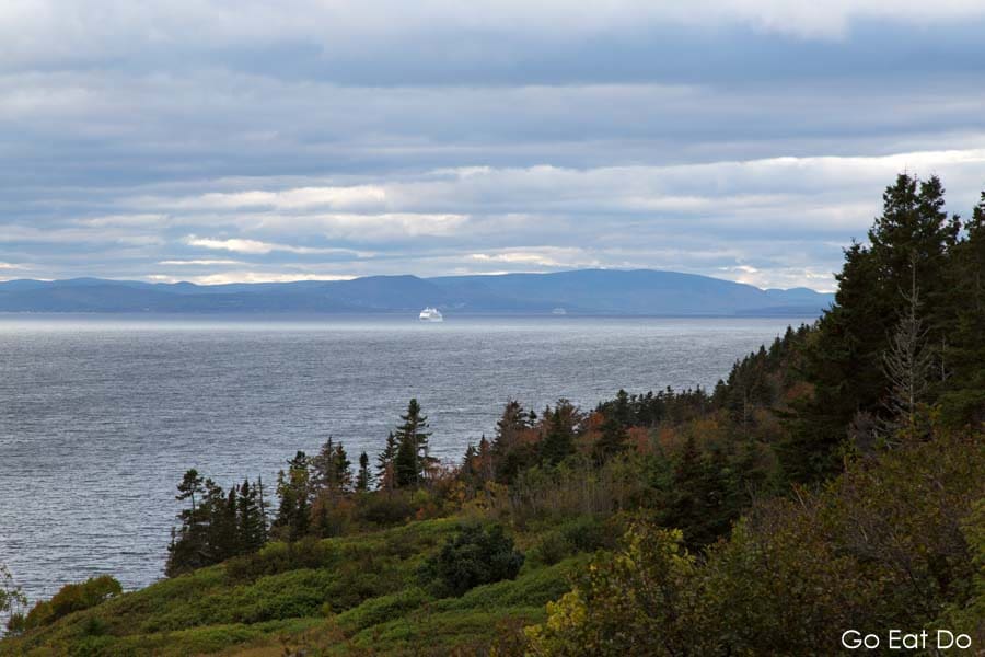 Cruise ship departing Gaspe in Quebec, Canada on an overcast day