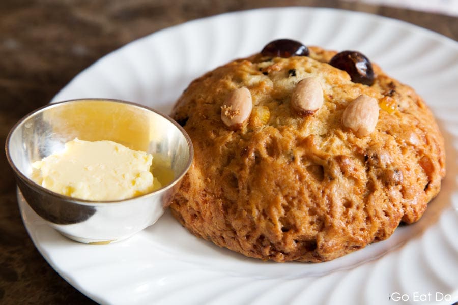 A Yorkshire Fat Rascal served with butter at Bettys Cafe Tea Room in Harrogate, North Yorkshire, England