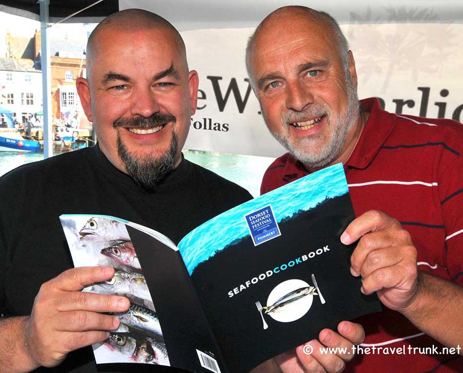 MasterChef winner Mat Follas and travel blogger and photographer Geoff Moore with a cook book they worked on together