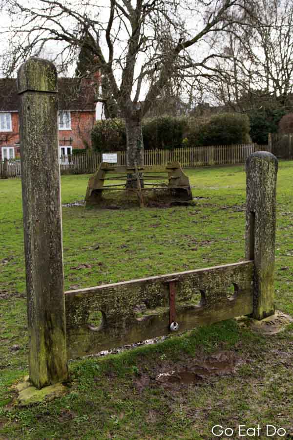 Genuine stock photography! The village stocks, a method of corporal punishement, at Minstead in New Forest National Park, England