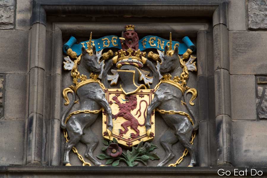 Coat of arms showing unicorns symbolising Scotland on a wall. For lovers of history there are many reasons to visit Edinburgh Castle.