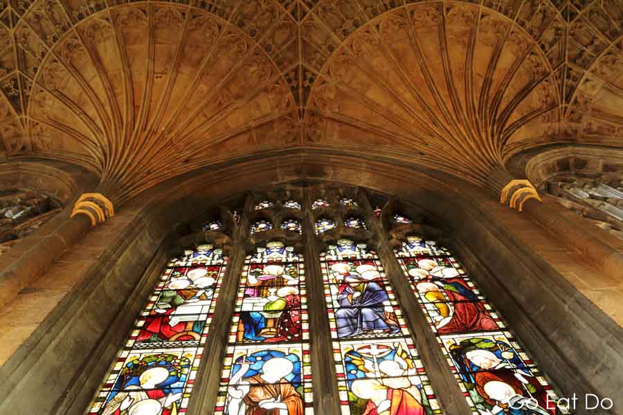 Fan vaulting on the ceiling above a stained glass window in the Lady Chapel at Peterborough Cathedral