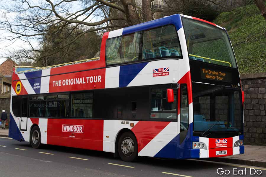 Open-topped double-decker bus tour with Union Jack paint in Windsor, England