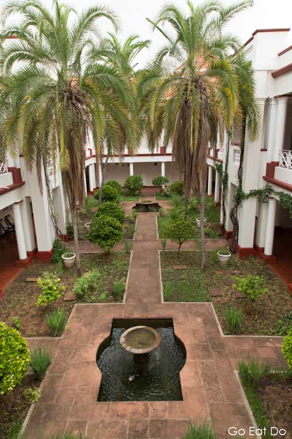 Palm trees in a courtyard of the Victoria Falls Hotel in Zimbabwe