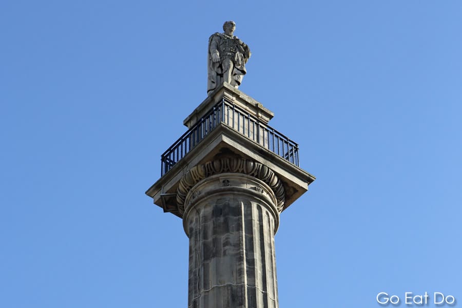 Statue, of former Prime Minister Charles Grey on top of Grey's Monument on a sunny day in Newcastle upon Tyne. The observation platform at the top of the monument offers some of the best views of Newcastle city centre.