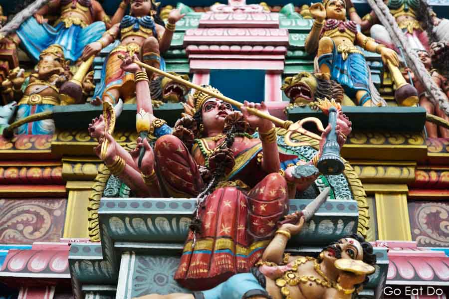 Coloufully painted deitites on a Hindu temple in Colombo, Sri Lanka