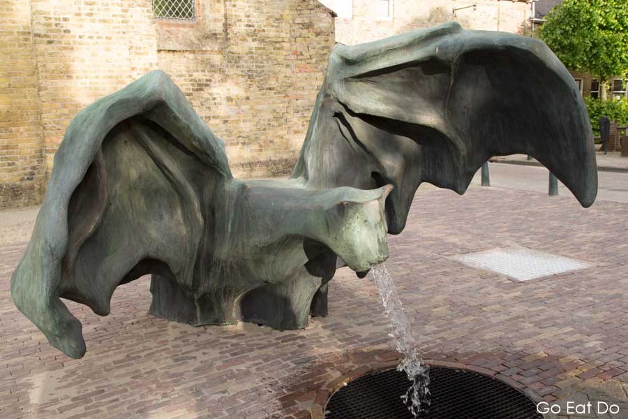 Water flows from the mouth of the De Vleermuis (The Bat), a fountain design by Johan Creten in Bolsward in the Netherlands, one of Friesland's 11 Fountains