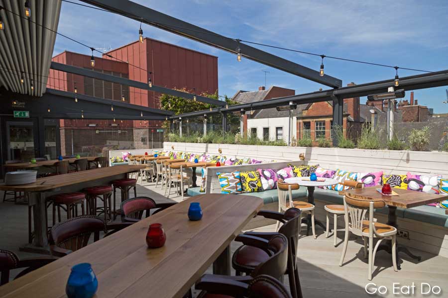 Seating and tables on the Santiago Sun Terrace, the rooftop terrace at Newcastle's Revolucion de Cuba