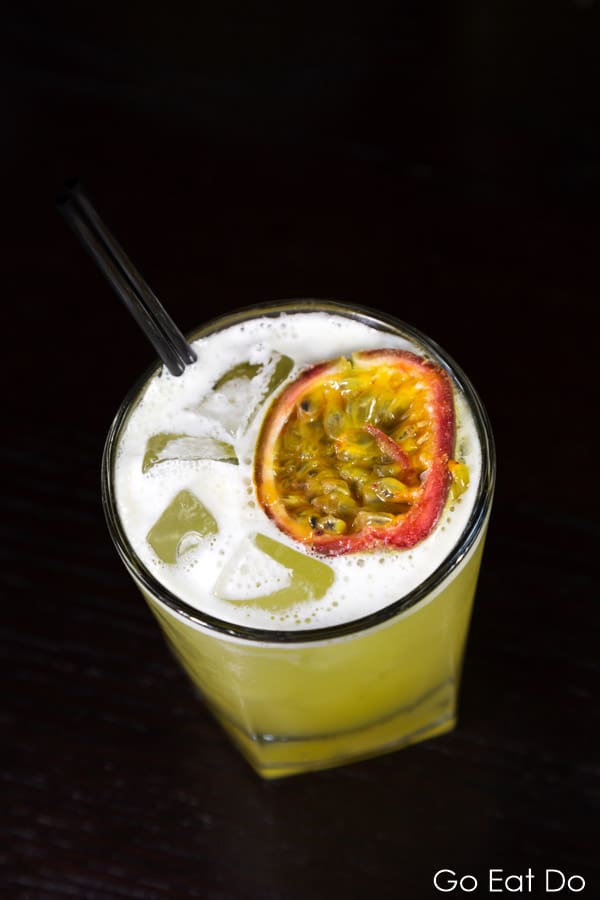 Rum based cocktail served with ice and passion fruit