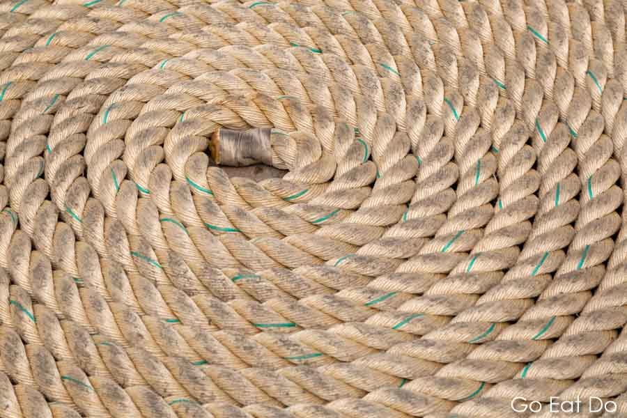 A coiled rope on the deck of a sailing ship participating in the 2018 Tall Ships Race