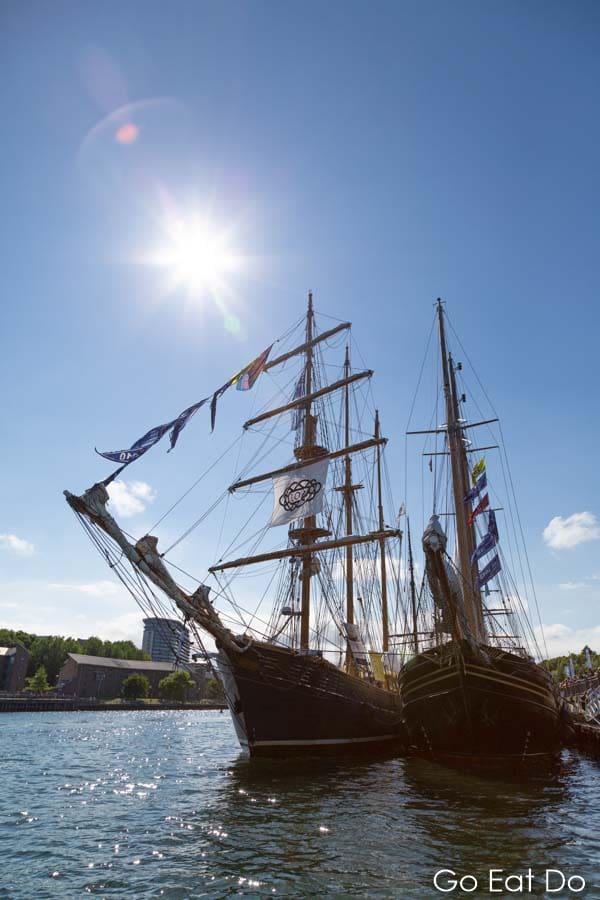 Sunshine over sailing ships moored on the River Wear during the 2018 Tall Ships Race in Sunderland, England