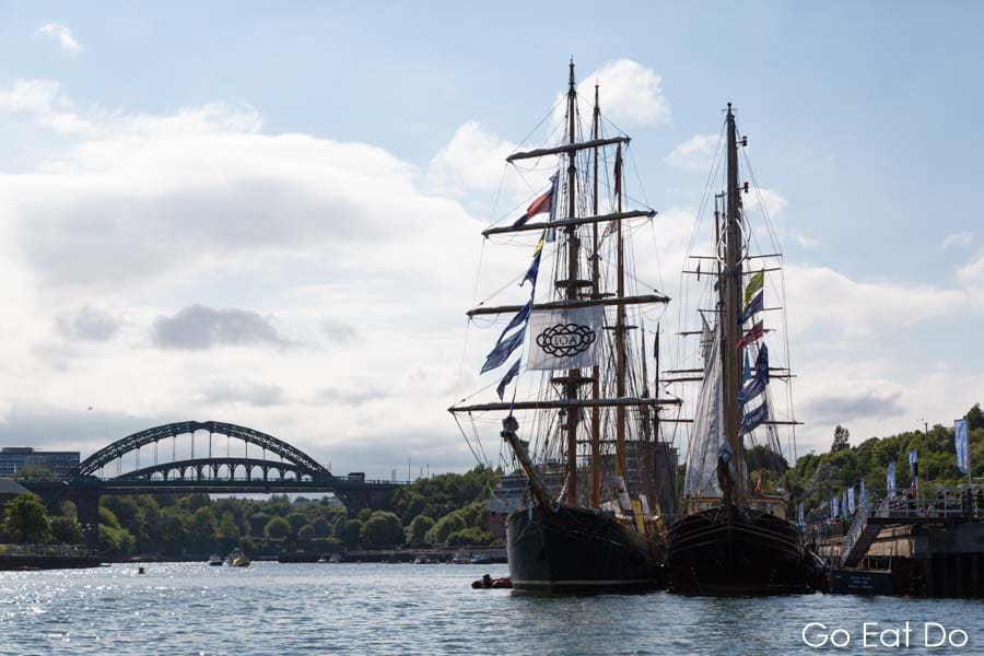 Sailing ships moored on the River Wear in front of the Wearmouth Bridge during the 2018 Tall Ships Race in Sunderland, England