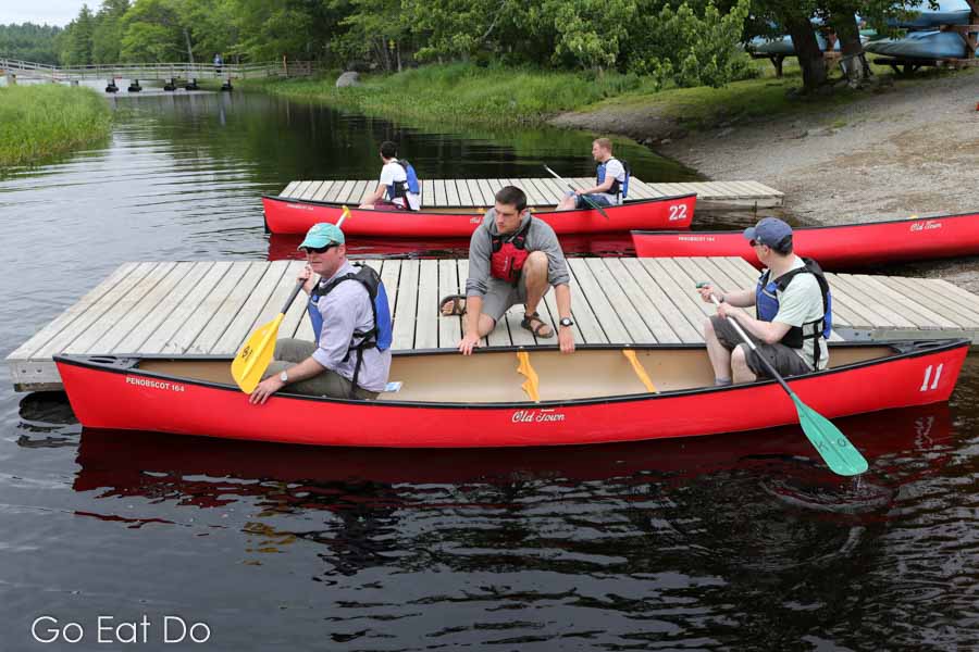 Launching canoes from Jakes Landing on a summer's day in Kejimkujik National Park, Nova Scotia