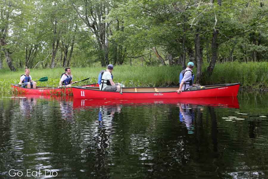 Tourists on the water during a canoe tour of Keji, Kejimkujik National Park in Nova Scotia, Canada