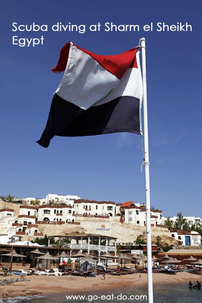 Egypt's national flag flies over Shark's Bay, a Red Sea resort in Egypt