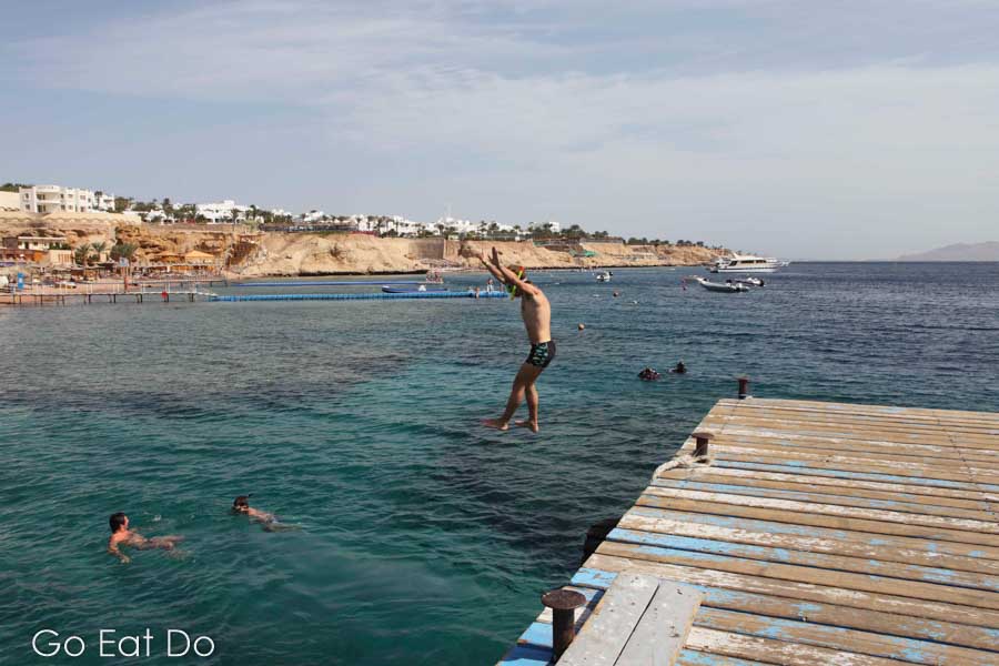Holidaymakers enjoy the clear Red Sea waters at Sharks Bay.