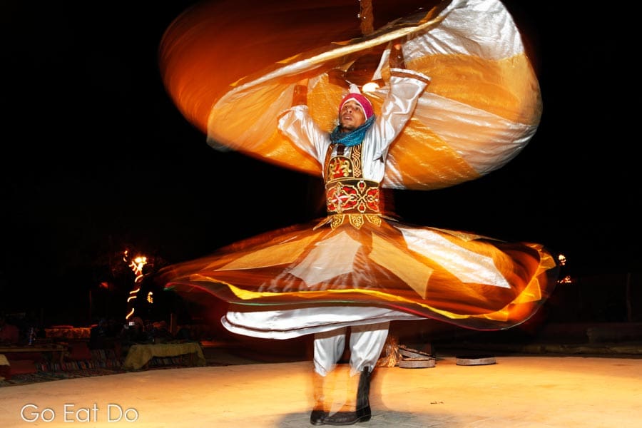 A Whirling Dervish dances to entertain tourists in Egypt. 