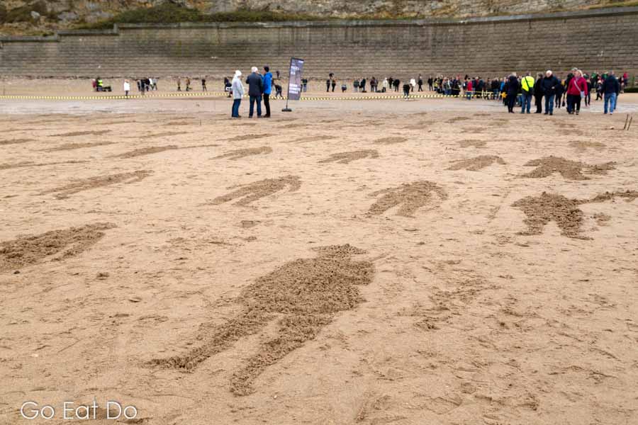 Shapes depicting British soldiers of World War One raked into sand on Roker Beach in Sunderland as part of the Pages of the Sea Remembrance Day event created by Danny Boyle.
