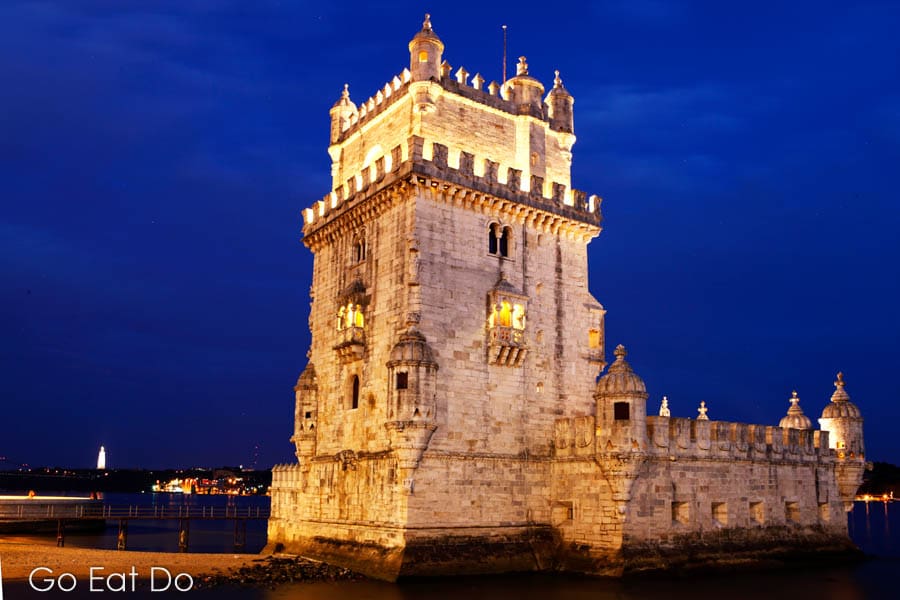 UNESCO World Heritage Site Tower of Belem illuminated at night by the River Tagus in Lisbon, Portugal