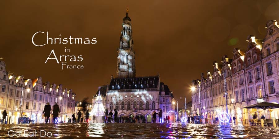 Christmas in Arras, France: the UNESCO World Heritage Site Belfry and Heroes Square is illuminated at night.
