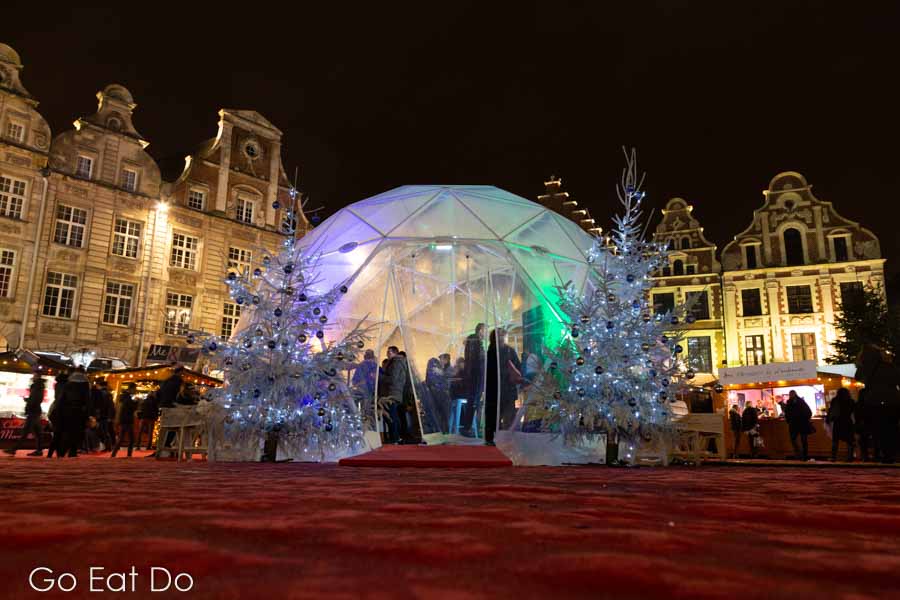 Igloo-style pod at night at Arras Christmas market in northern France