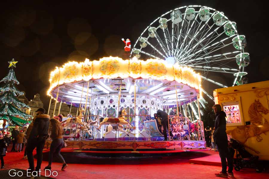 Carousel and Ferris wheel at Arras Christmas market in northern France