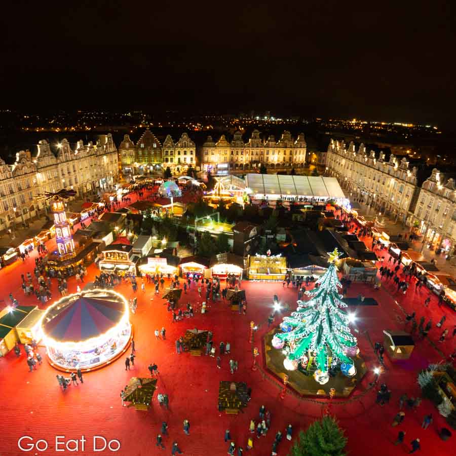Grand Place and Arras Christmas market at night seen from the Ferris wheel in Arras, France