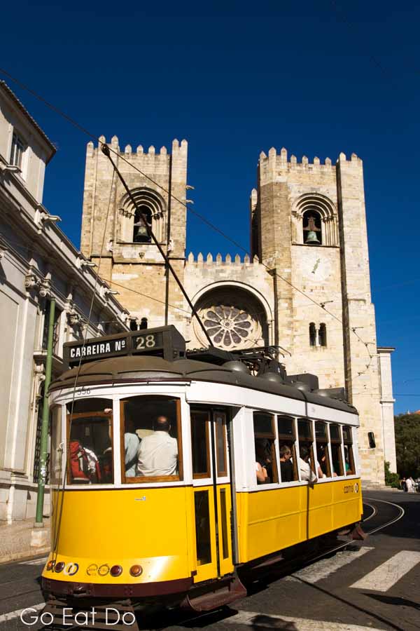 Tram 28 at the Se Cathedral in the Alfama district of Lisbon, Portugal