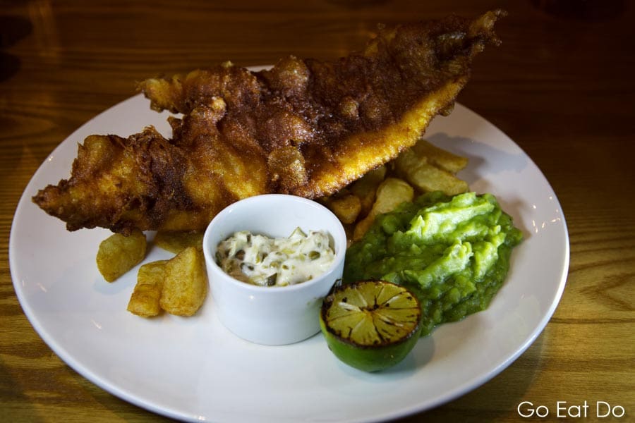 Fish and chips with mushy peas served at the Malton Brasserie in Malton, North Yorkshire