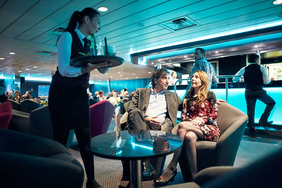 Couple at the Columbus Club on a DFDS ferry Dinner about a ferry (Photo courtesy of Discover Ferries).