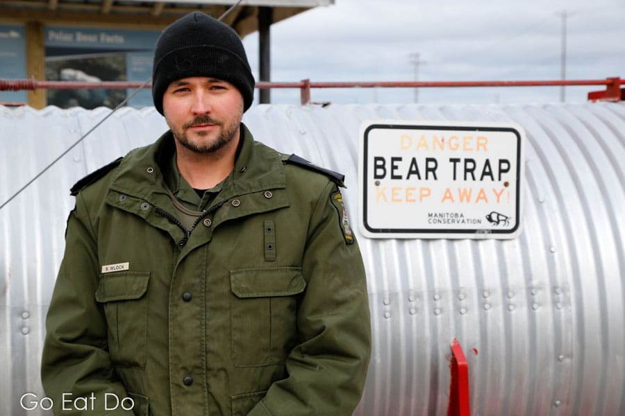 Brett Whitlock by a bear trap in Churchill, Manitoba, Canada