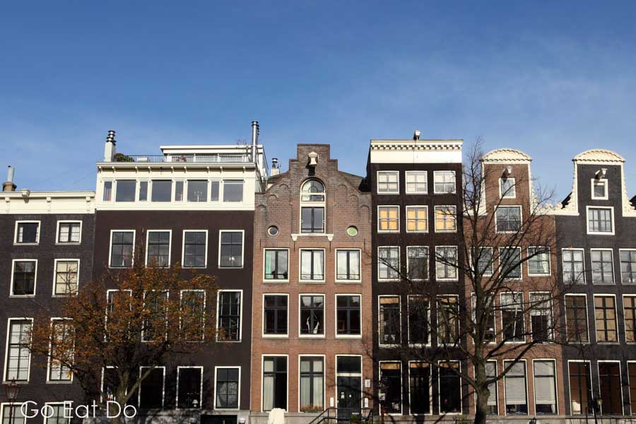 Traditional gabled Dutch housing on a sunny spring day in Amsterdam, the Netherlands
