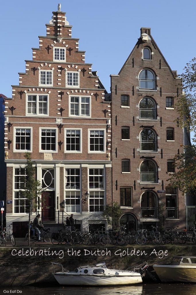 Pinterest pin for Go Eat Do's post on Celebrating the Dutch Golden Age Dutch featuring gabled facades in Amsterdam, the Netherlands