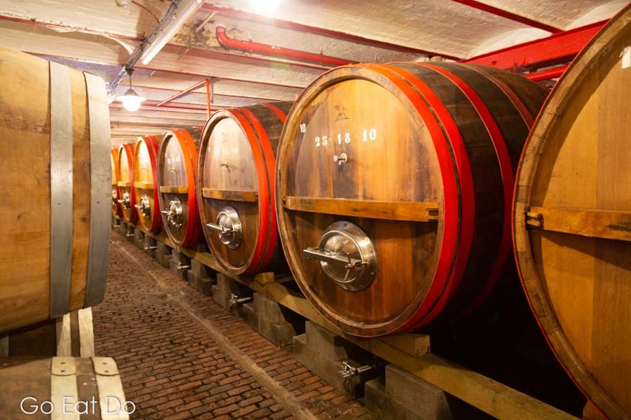 Barrels of lambic beer aging in wooden barrels in Timmermans Brewery in Belgium
